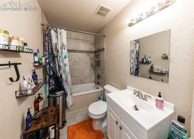 2914 Del Mar Cir, Colorado Springs, CO 80910 - bathroom featuring tile patterned flooring, toilet, a textured wall, vanity, and shower / bath combination with curtain