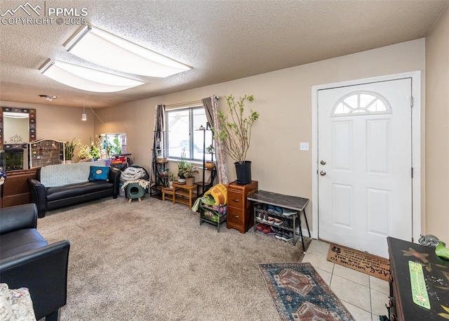 2914 Del Mar Cir, Colorado Springs, CO 80910 - living area featuring a textured ceiling and light colored carpet