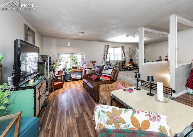 2914 Del Mar Cir, Colorado Springs, CO 80910 - living area featuring a textured ceiling and wood finished floors