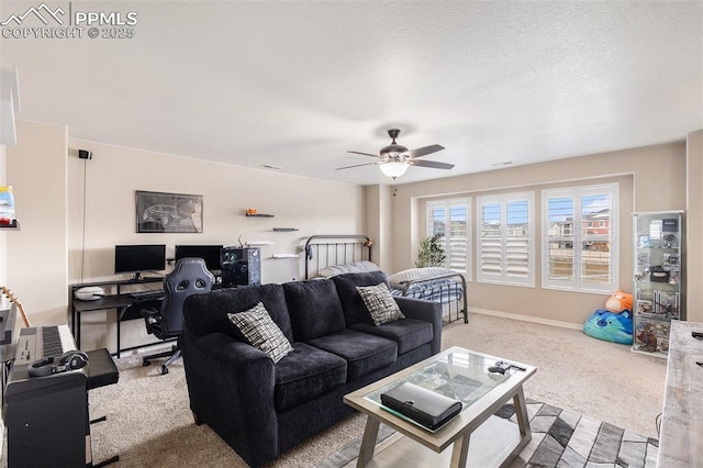 living room with baseboards, a ceiling fan, and carpet floors