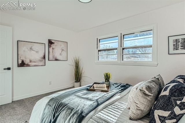 carpeted bedroom with baseboards