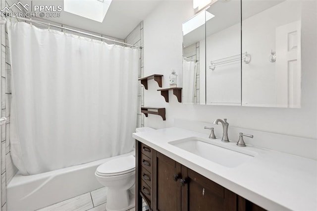 6745 Fielding Cir, Colorado Springs, CO 80911 - bathroom featuring vanity, toilet, shower / bath combo, and a skylight