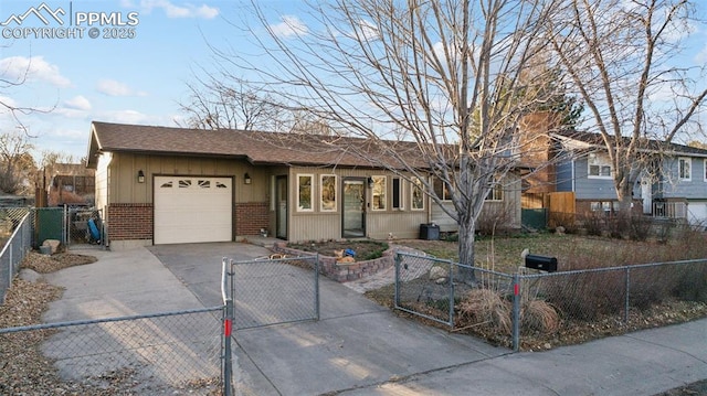 6745 Fielding Cir, Colorado Springs, CO 80911 - ranch-style home featuring a gate, concrete driveway, an attached garage, brick siding, and a fenced front yard