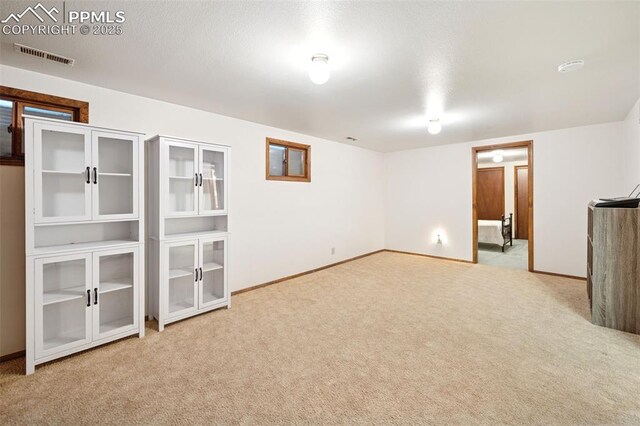 6745 Fielding Cir, Colorado Springs, CO 80911 - finished basement featuring carpet floors, baseboards, and visible vents
