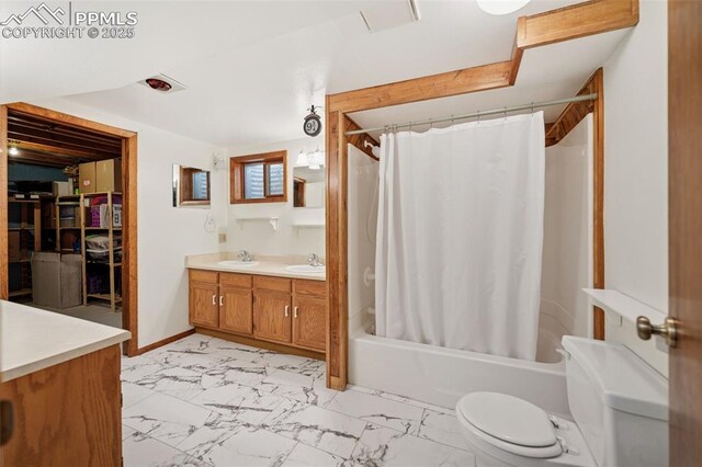 6745 Fielding Cir, Colorado Springs, CO 80911 - full bath featuring marble finish floor, double vanity, toilet, a sink, and shower / bathtub combination with curtain