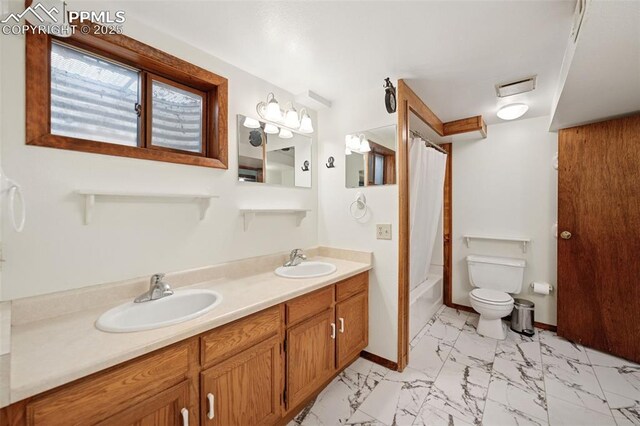 6745 Fielding Cir, Colorado Springs, CO 80911 - full bath featuring marble finish floor, visible vents, a sink, and toilet