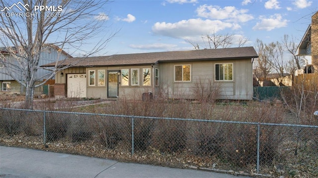 6745 Fielding Cir, Colorado Springs, CO 80911 - view of front of property featuring a fenced front yard and roof with shingles