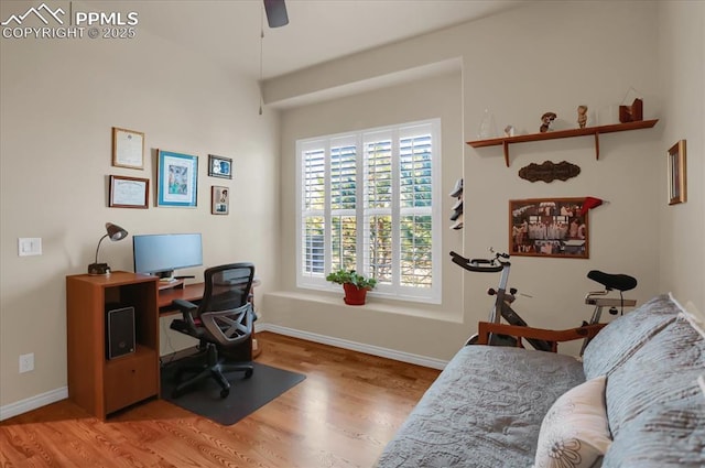office with a ceiling fan, baseboards, and wood finished floors