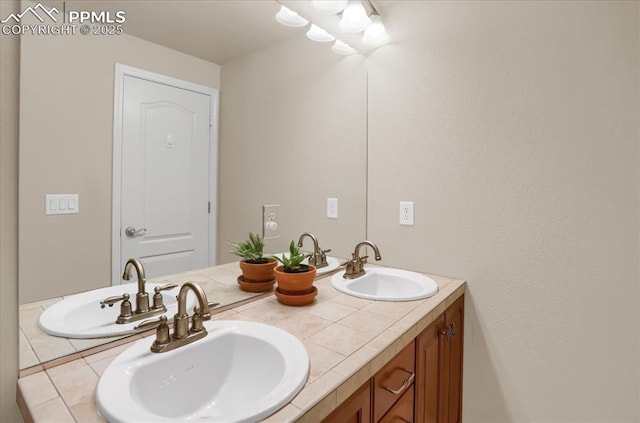 bathroom featuring double vanity and a sink