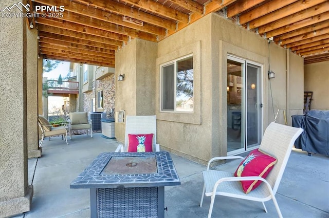view of patio featuring outdoor dining area and a grill