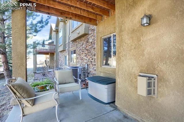 view of patio / terrace with central AC unit
