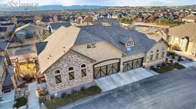 birds eye view of property featuring a residential view and a mountain view