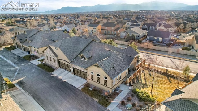 aerial view featuring a mountain view and a residential view