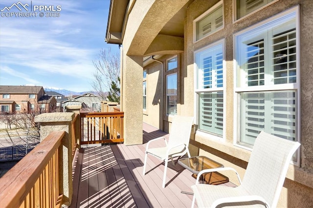 wooden deck with a residential view