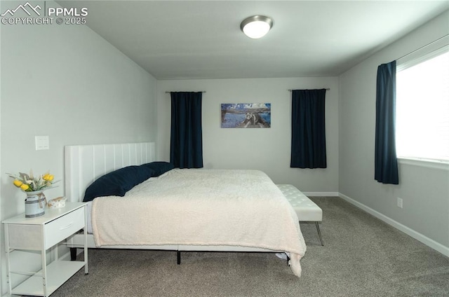 carpeted bedroom with baseboards