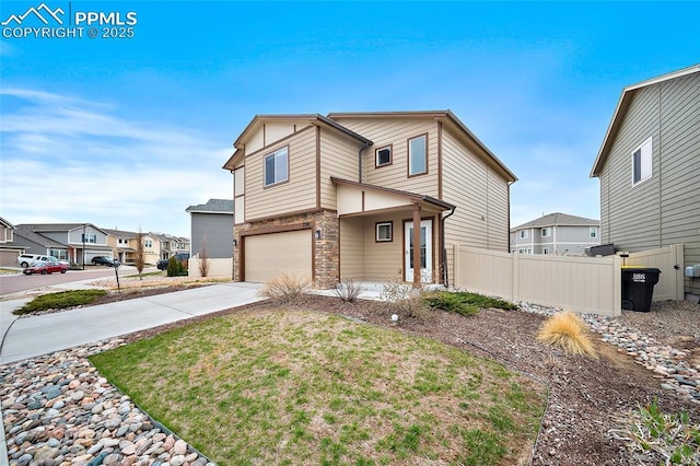 7718 Benecia Dr, Fountain, CO 80817 - view of front of property featuring stone siding, a garage, fence, a residential view, and driveway