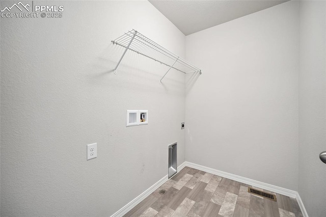 7718 Benecia Dr, Fountain, CO 80817 - washroom with visible vents, baseboards, laundry area, wood finished floors, and hookup for a washing machine