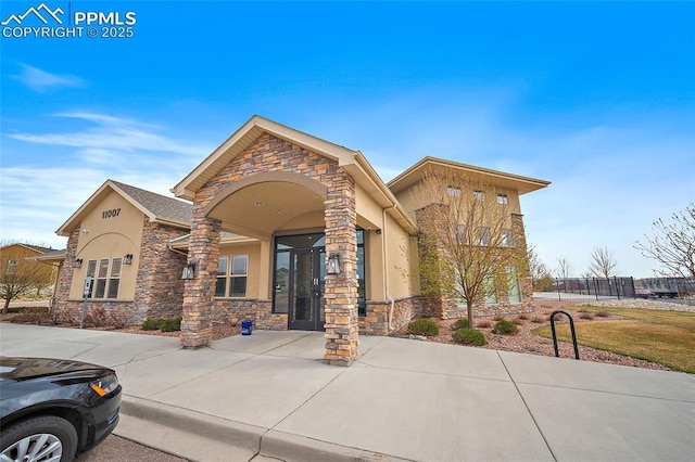 7718 Benecia Dr, Fountain, CO 80817 - view of front facade with stucco siding and stone siding