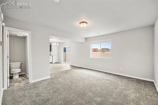 7718 Benecia Dr, Fountain, CO 80817 - carpeted empty room featuring a chandelier and baseboards