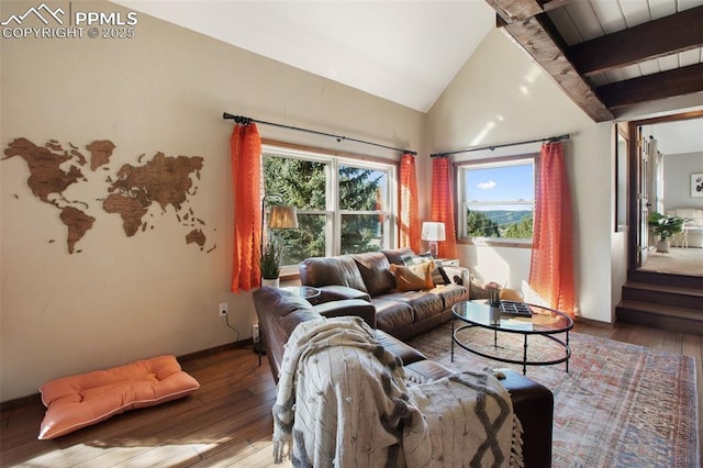 living room featuring vaulted ceiling with beams and wood-type flooring