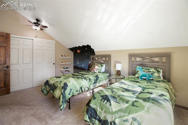 bedroom with a closet, a ceiling fan, carpet flooring, and lofted ceiling