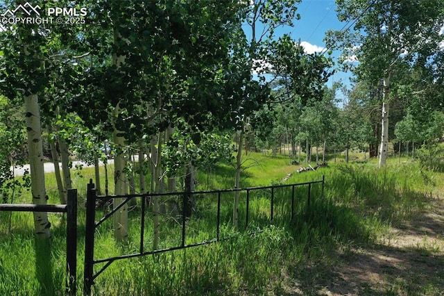view of gate featuring fence