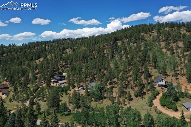 aerial view featuring a view of trees