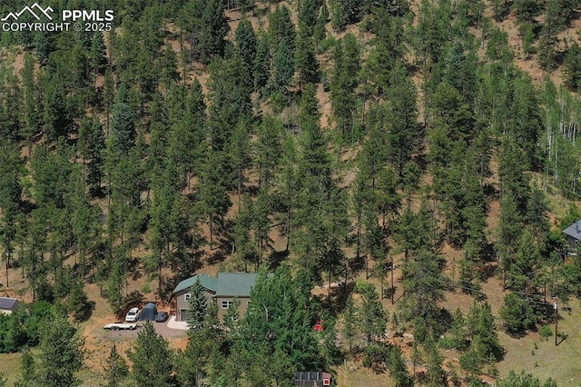aerial view featuring a view of trees