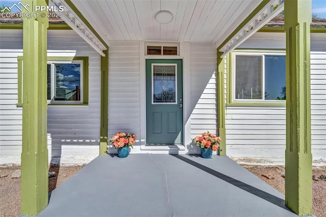 doorway to property with a porch