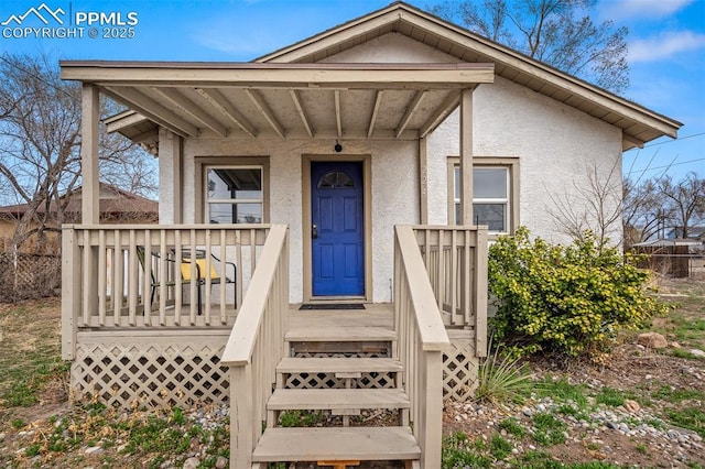 224 W Mill St, Colorado Springs, CO 80903 - doorway to property featuring stucco siding