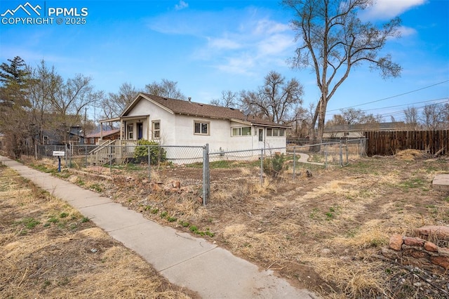 224 W Mill St, Colorado Springs, CO 80903 - view of side of home featuring stucco siding and fence private yard