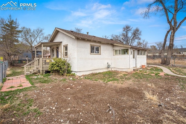 224 W Mill St, Colorado Springs, CO 80903 - view of home's exterior with a fenced backyard and stucco siding