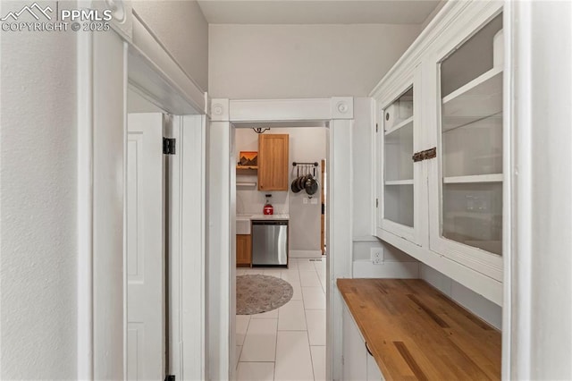 corridor featuring light tile patterned flooring