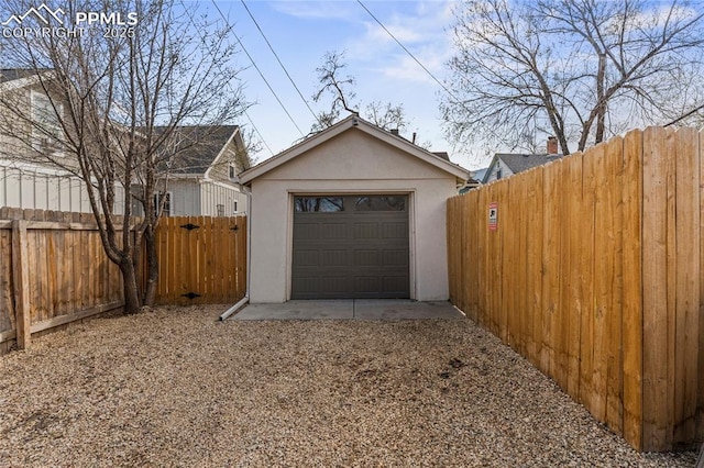 detached garage with fence