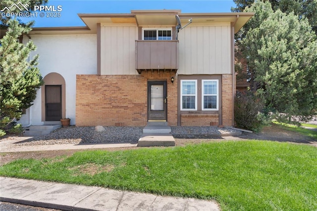 1187 Willow Bend Cir Unit A # 4, Colorado Springs, CO 80918 - view of front of property featuring brick siding and a front yard