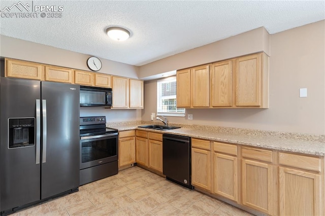 1187 Willow Bend Cir Unit A # 4, Colorado Springs, CO 80918 - kitchen with black appliances, light brown cabinets, light countertops, and a textured ceiling