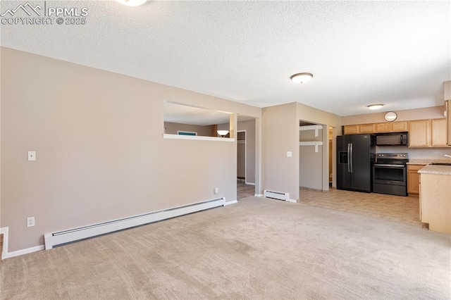 1187 Willow Bend Cir Unit A # 4, Colorado Springs, CO 80918 - kitchen with black appliances, baseboard heating, light brown cabinetry, light countertops, and a textured ceiling