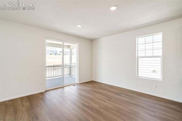 1821 Water Birch Way, Castle Rock, CO 80108 - empty room featuring baseboards, visible vents, wood finished floors, and recessed lighting