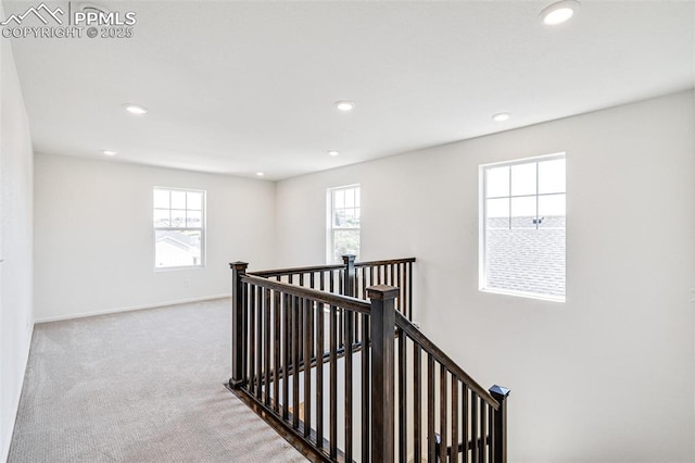 1821 Water Birch Way, Castle Rock, CO 80108 - hallway with recessed lighting, an upstairs landing, and light carpet