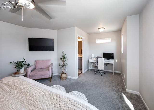 bedroom featuring baseboards, carpet flooring, ensuite bathroom, and a ceiling fan