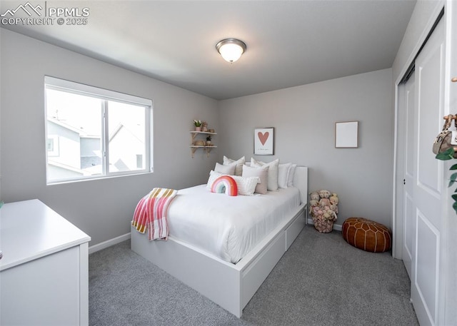 bedroom featuring a closet, carpet floors, and baseboards