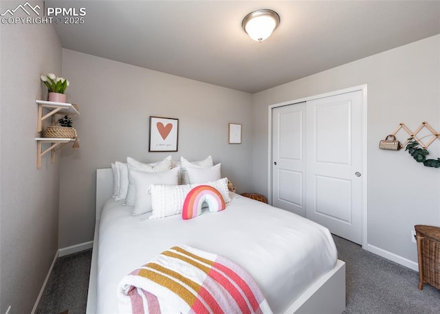 carpeted bedroom featuring a closet and baseboards