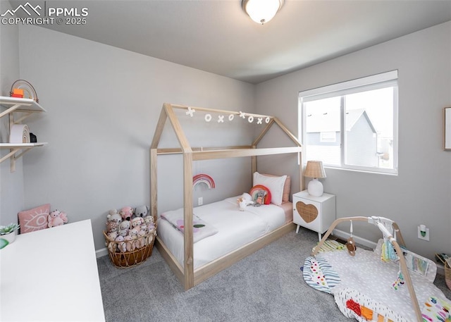 bedroom with baseboards and carpet floors