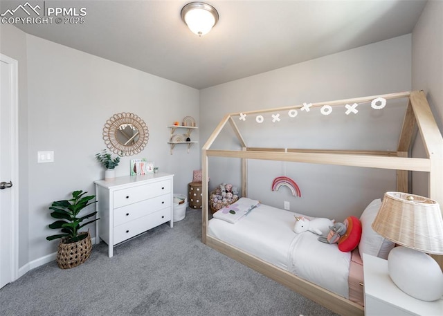 carpeted bedroom featuring baseboards