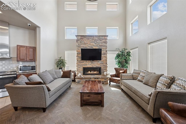 10713 Traders Pkwy, Fountain, CO 80817 - living room with a high ceiling and a stone fireplace