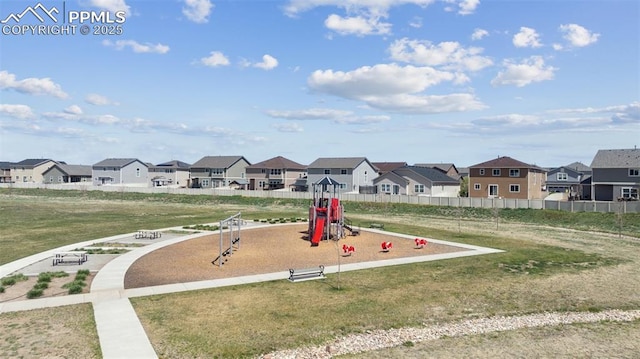 10713 Traders Pkwy, Fountain, CO 80817 - community jungle gym featuring fence, a residential view, and a lawn