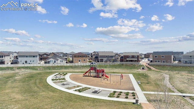 10713 Traders Pkwy, Fountain, CO 80817 - community jungle gym featuring a residential view, a yard, and fence