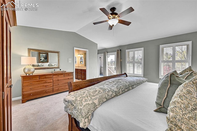carpeted bedroom with lofted ceiling, baseboards, and a ceiling fan