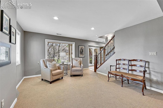 living area featuring carpet, baseboards, recessed lighting, and stairs