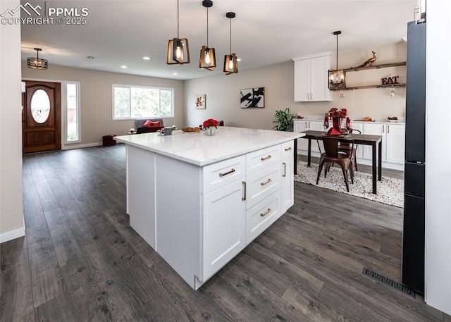 1021 Pioneer Ln, Colorado Springs, CO 80904 - kitchen featuring white cabinetry, dark wood-type flooring, pendant lighting, recessed lighting, and open floor plan